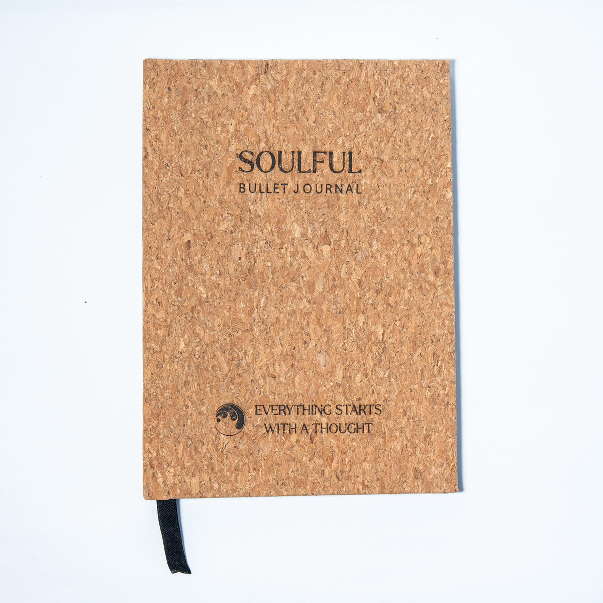 A5 cork bullet journal flat lay with dot-grid pages open