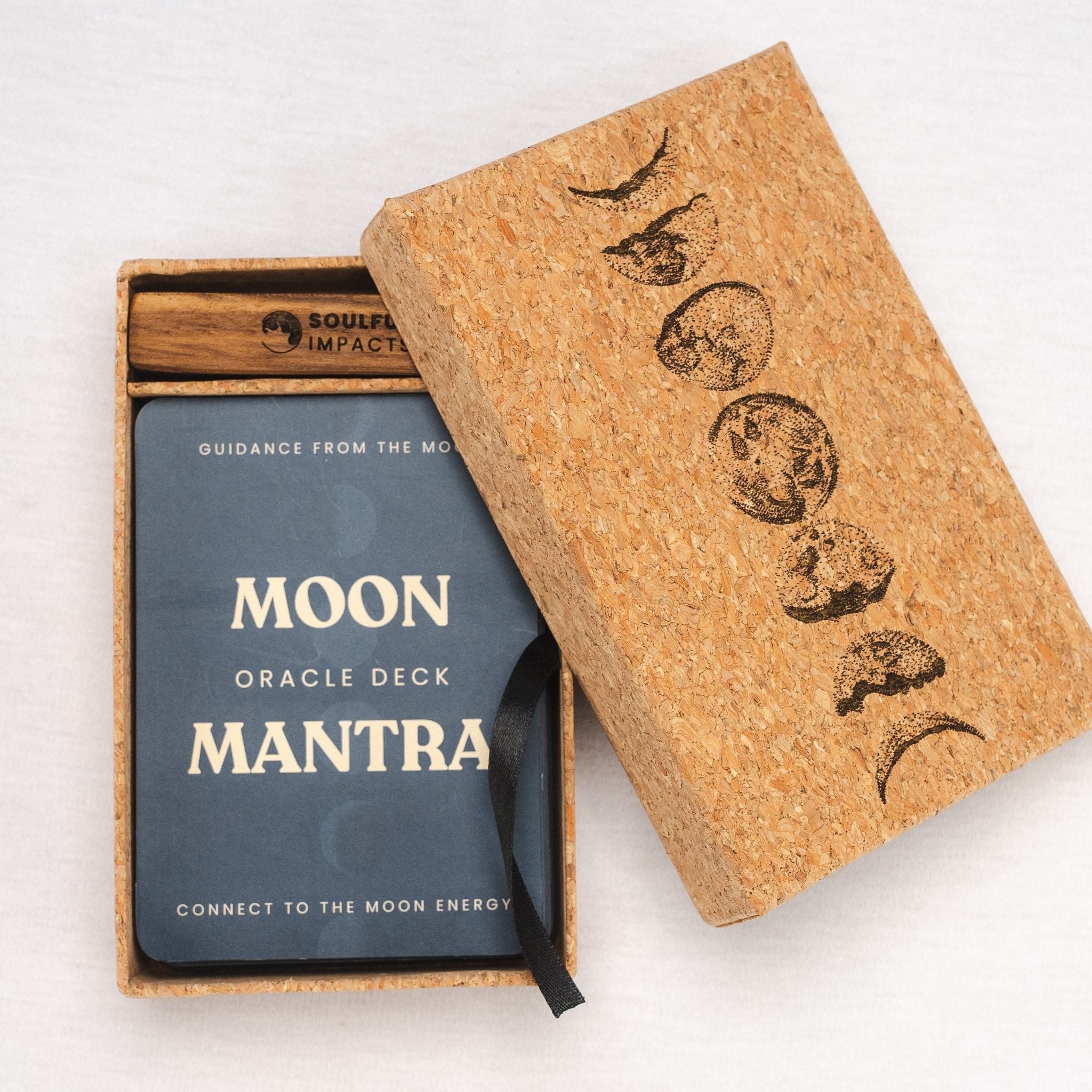 Moon Oracle Deck packaging with cork box and blue deck inside on a white background
