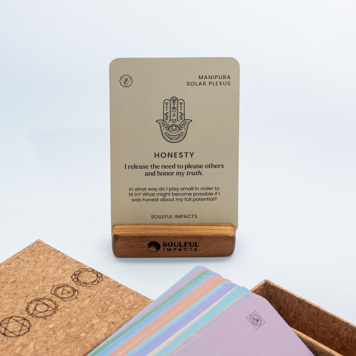 Chakra Affirmation Card Deck shown with cork box and wooden card stand