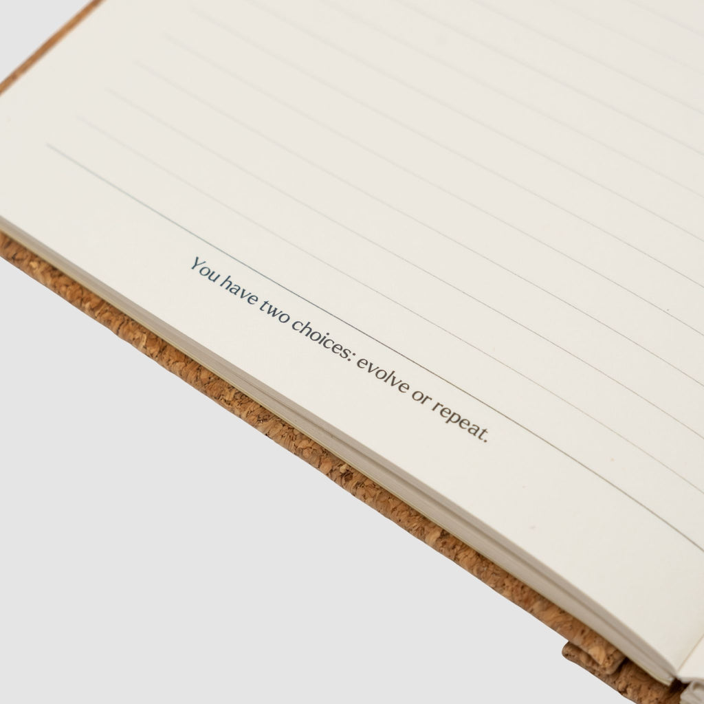 Open notebook with a motivational quote on a white background