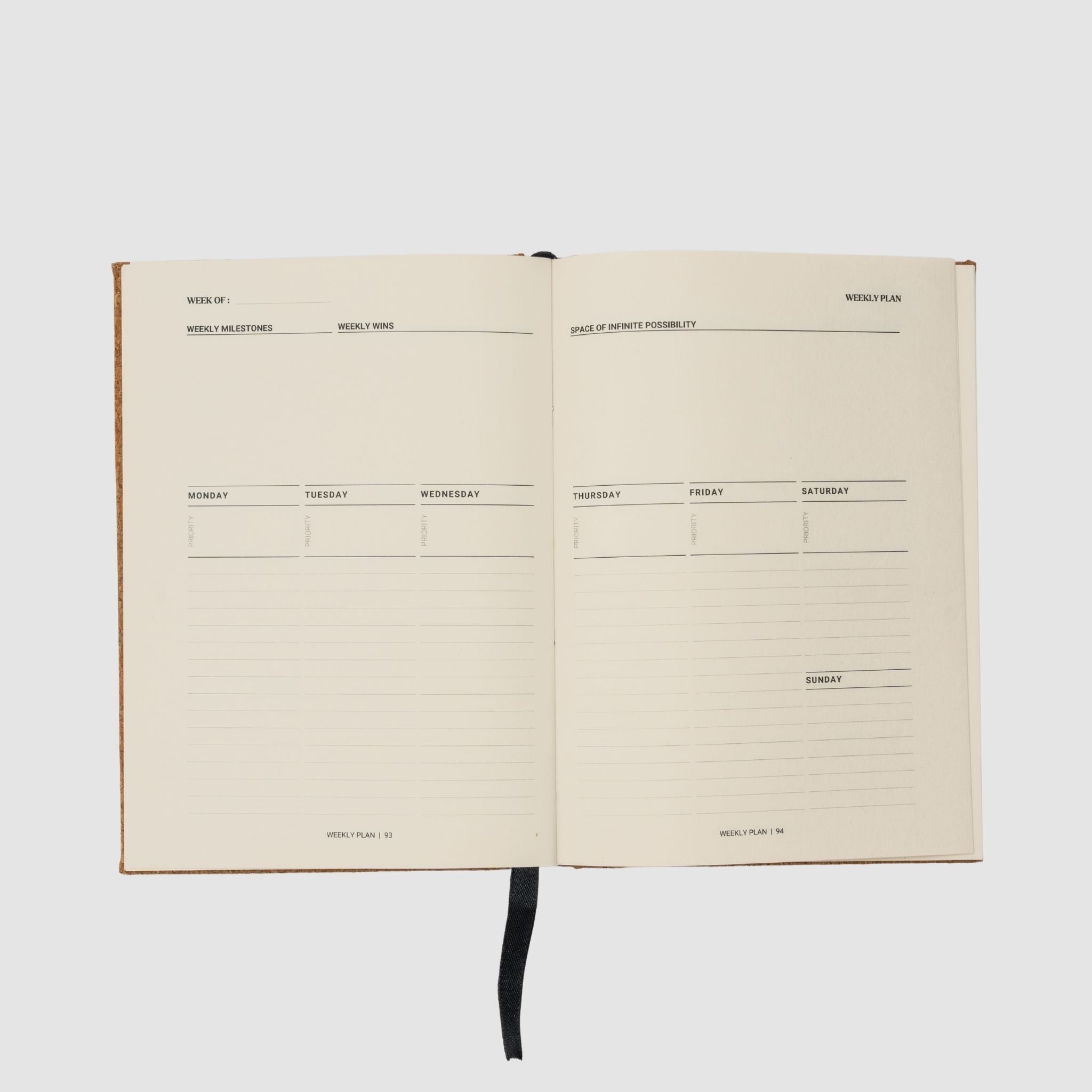Open planner with weekly schedule layout on a white background